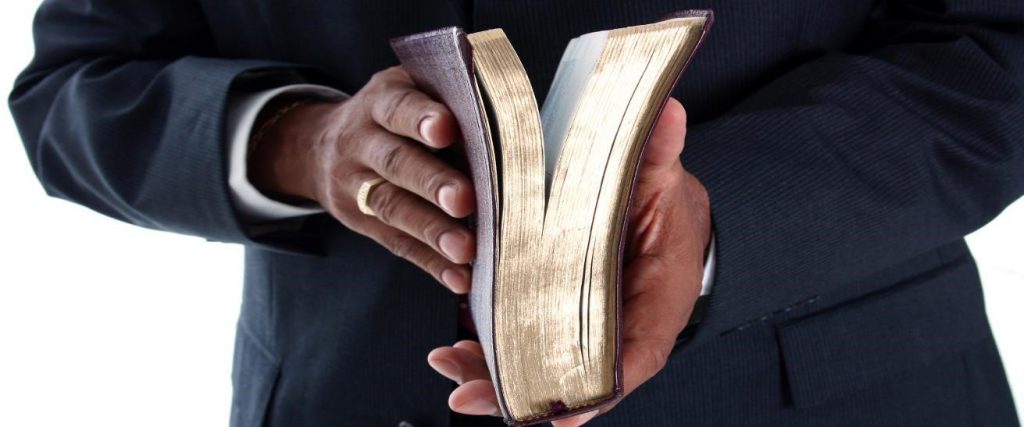 Pastor holding a bible